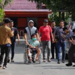 LAN, tersangka perkara utang Rp160 ribu berbuntut tragis, digiring polisi di Palu.